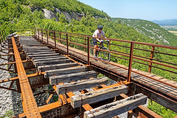 Crossing an old railway bridge on the Ciro Trail.