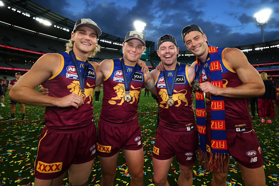 Will Ashcroft, Levi Ashcroft, Lachie Neale and Josh Dunkley celebrate winning the AFL premiership.