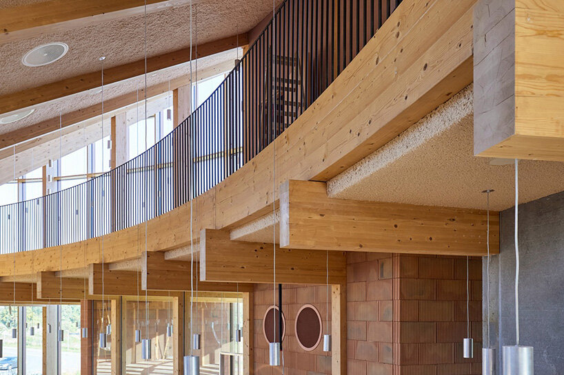 watch: ballet dancers take over BIG's circular timber building of dymak HQ in denmark