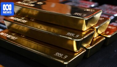 Gold's record run rolls on with prices surging past $US5,000 as investors seek safety