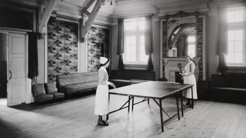 Warneford Two nurses playing table tennis in an archive image