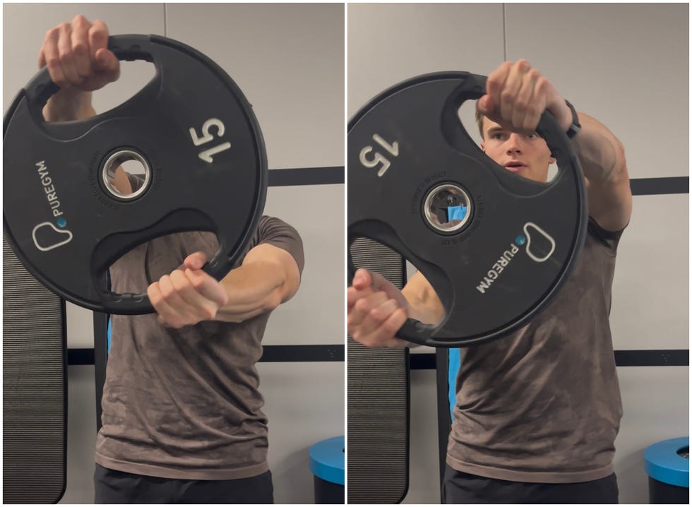 person performing an exercise with a weight plate
