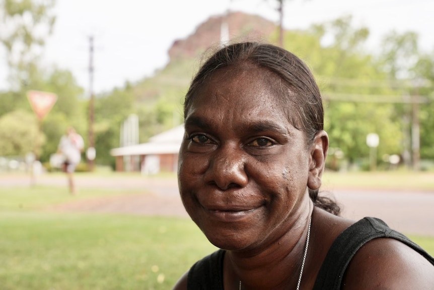 Aboriginal woman with silver necklace smiling