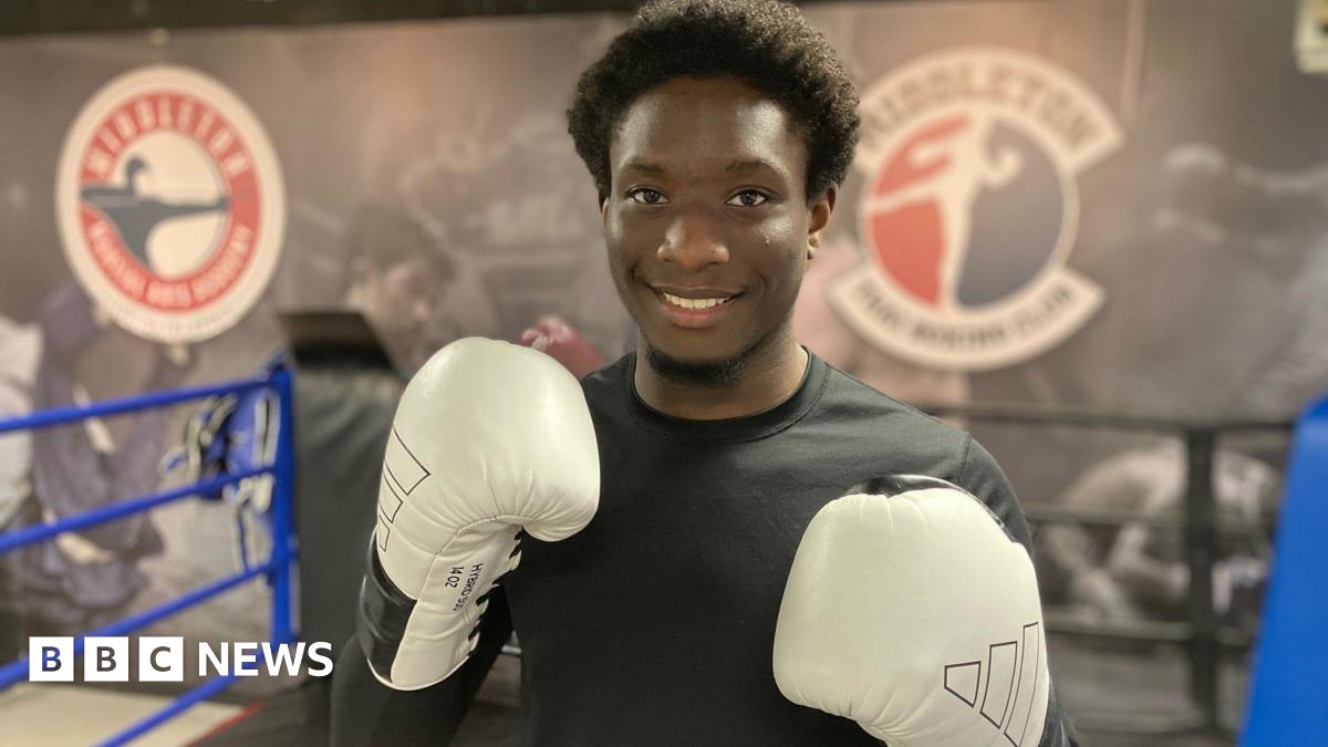 Divine in the gym with boxing gloves on