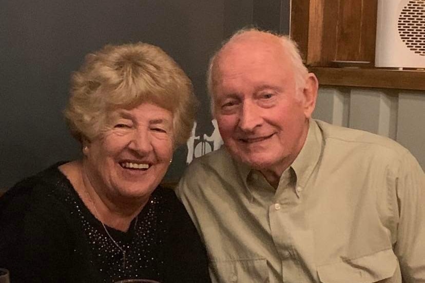 An older woman and man smiling