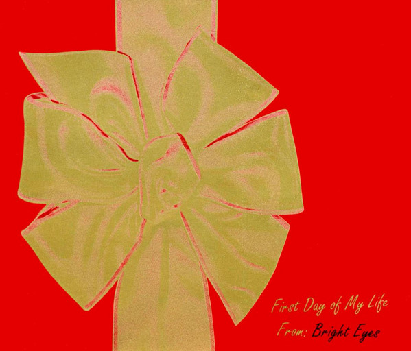 Illustration of a gold bow on red background. Text reads: First day of my life from: bright Eyes