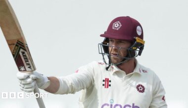 Northamptonshire's Luke Procter raises his bat