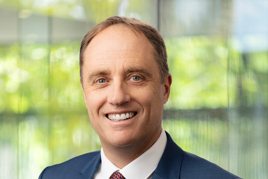 A close-up of a man in a suit.