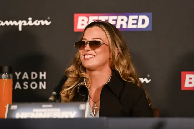 Francesca Hennessy grins wearing sunglasses