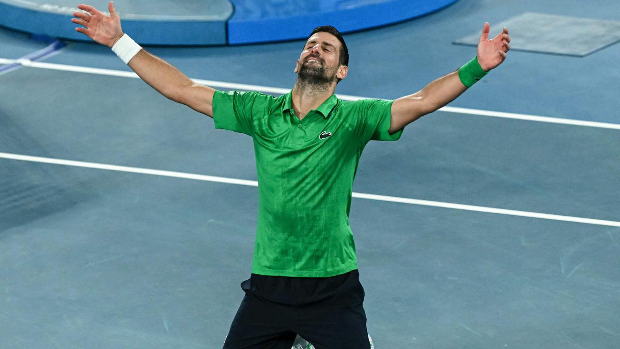 TOPSHOT - Serbia's Novak Djokovic celebrates victory over Italy's Jannik Sinner after their men's singles semi-final match on day thirteen of the Australian Open tennis tournament in Melbourne on January 31, 2026. (Photo by WILLIAM WEST / AFP) / -- IMAGE RESTRICTED TO EDITORIAL USE - STRICTLY NO COMMERCIAL USE --