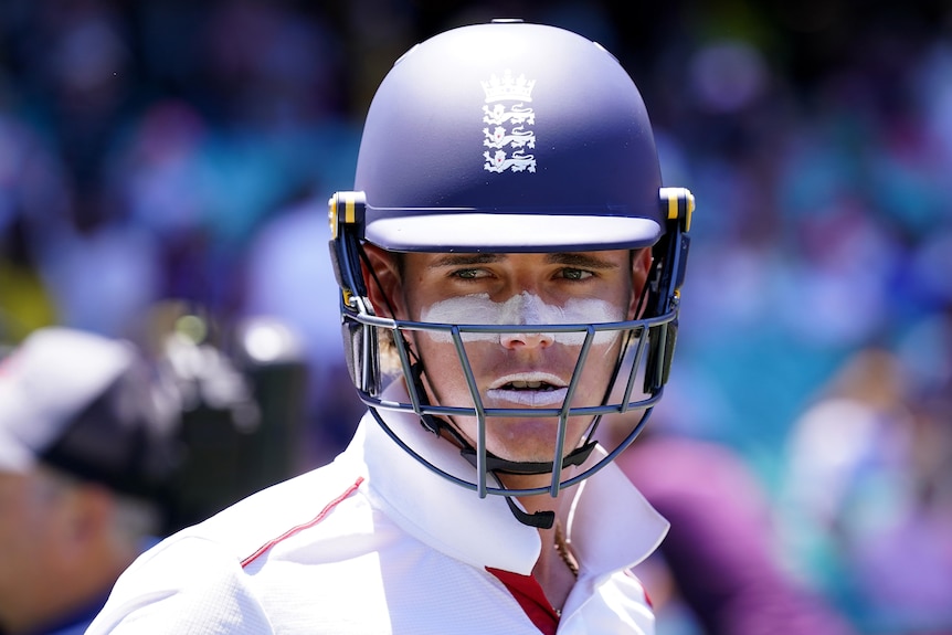 England batter Jacob Bethell looks at the camera while wearing his batting helmet.