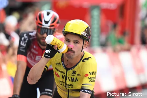 Victor Campenaerts takes a drink from his bottle whilst riding at La Vuelta 2025