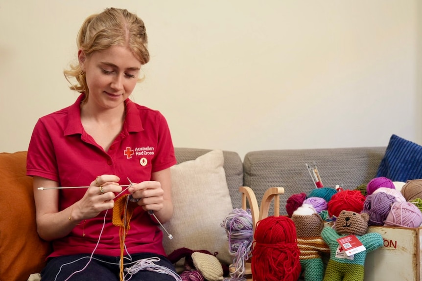 Lucinda Nube Red Cross Volunteer with her knitted trauma teddy