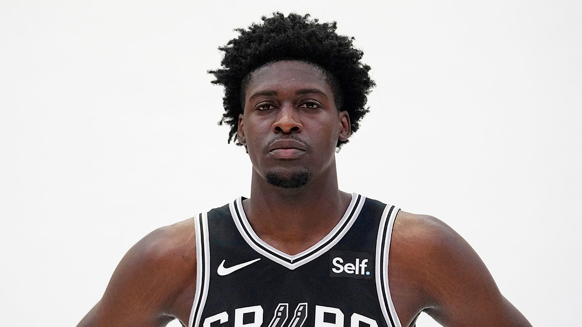 Charles Bediako poses for photos