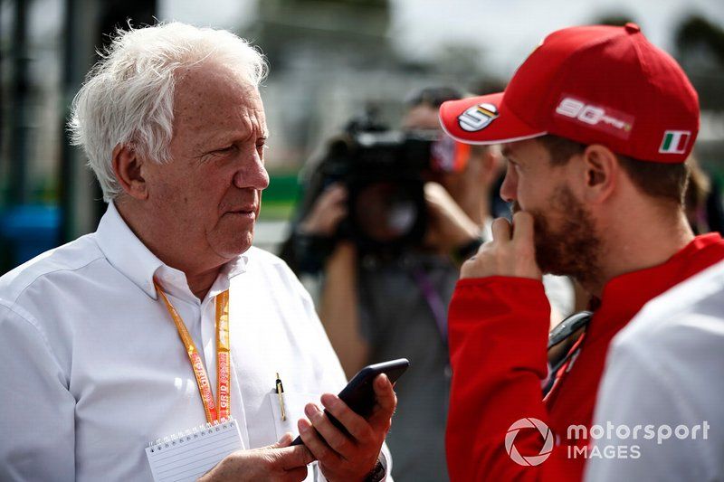 Charlie Whiting, Race Director, FIA, with Sebastian Vettel, Ferrari