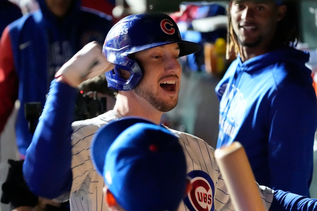 Chicago Cubs right fielder Kyle Tucker (30) reacts in the dugout after hitting a home run.