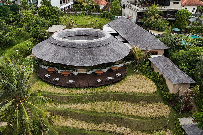 circular bamboo roof collects rainwater at balinese restaurant by pablo luna studio