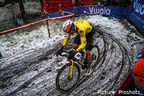 Wout van Aert of Visma in a snowy corner at the Exact Cross Mol