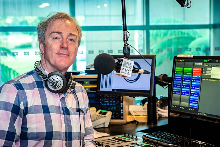 ABC Classic's Christopher Lawrence behind the radio desk.