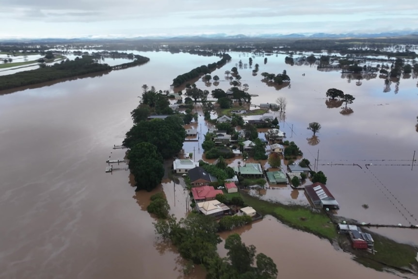 Aerial view of flooded homes where river has broken its banks.