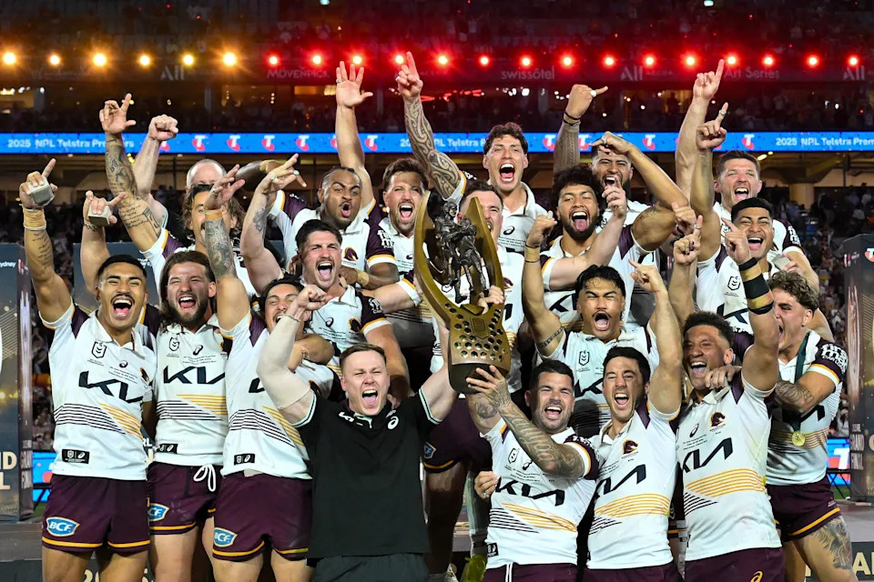 This image shows Brisbane Broncos players celebrating after their 2025 NRL grand final win over the Melbourne Storm.