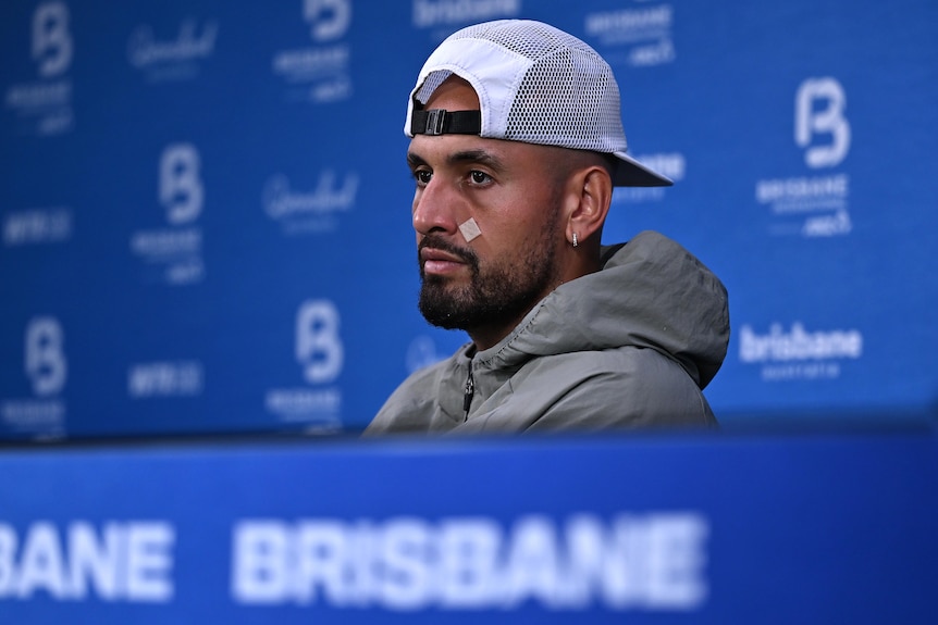 Nick Kyrgios talks at a press conference