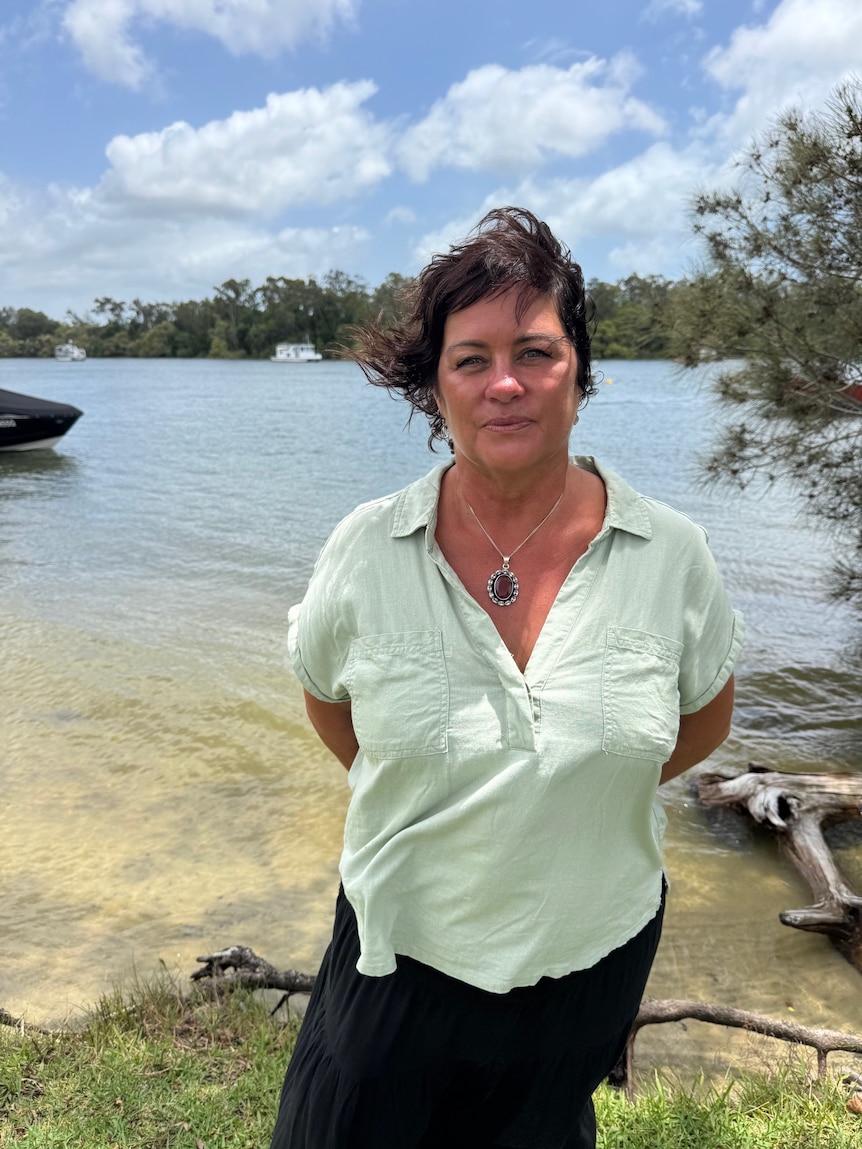 Woman standing near river.
