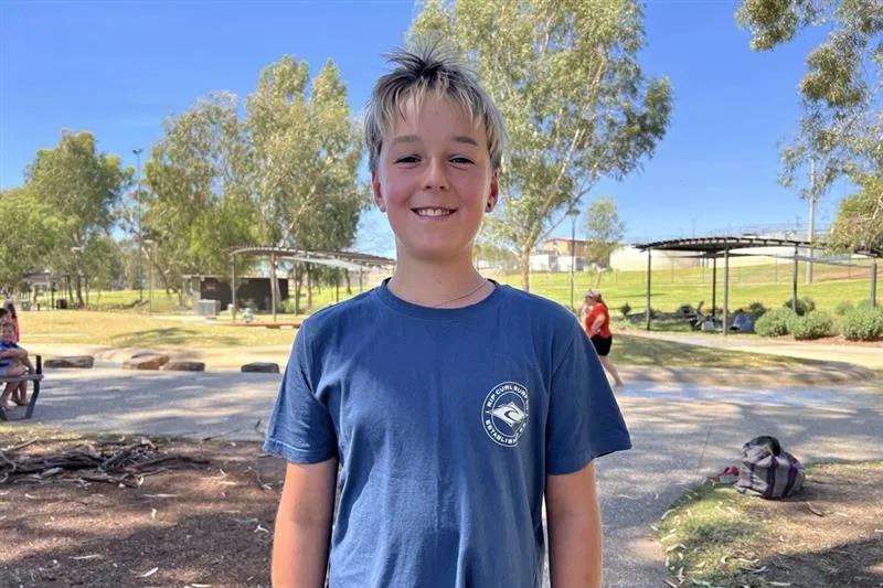 Angus smiles at the camera.