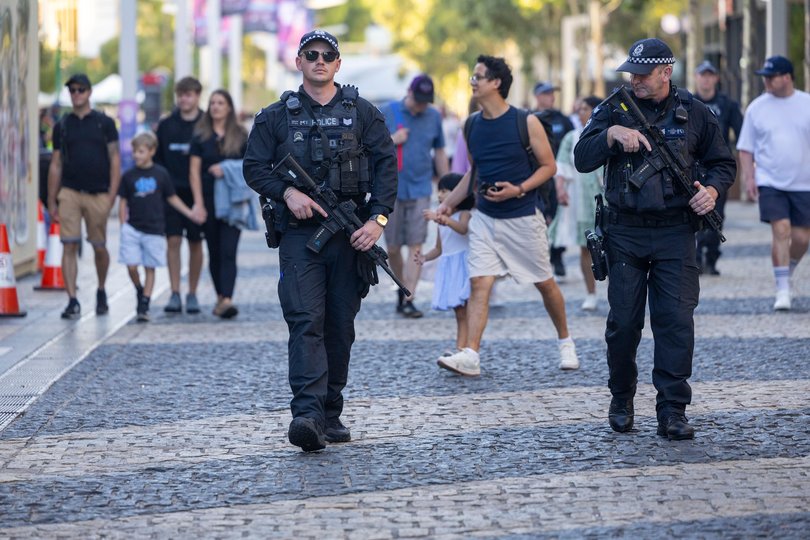 Armed WA Police stood watch at Elizabeth Quay, carrying long arm rifles as pop music played over loudspeakers and crowds gathered ahead of the fireworks celebrations. 