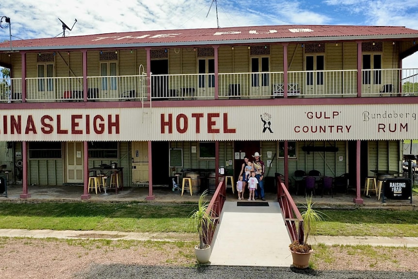 Family outside an old pub.