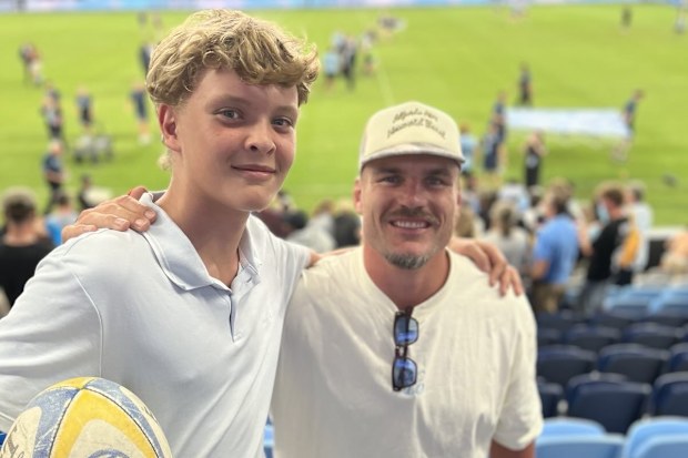 Manly junior Axel meets NRL star Angus Crichton at the Waratahs game.
