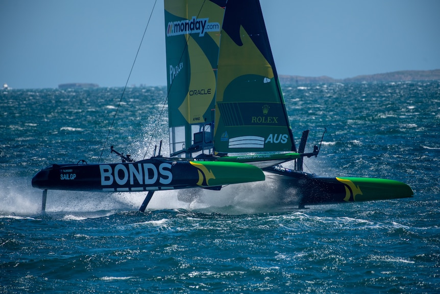 Boats racing on water. 