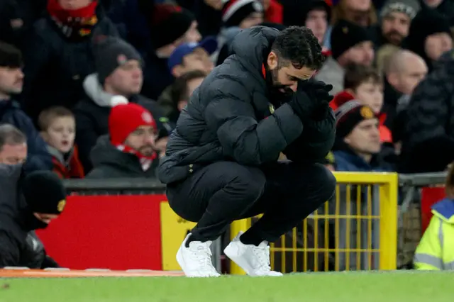 Amorim crouches on the touchline