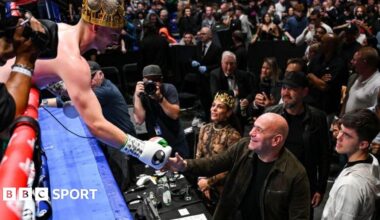 Callum Walsh in the ring with his coach Freddie Roach beside him
