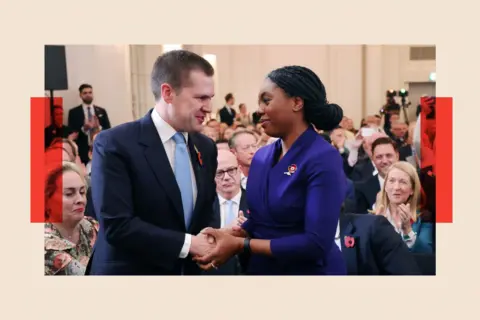 EPA-EFE/REX/Shutterstock Kemi Badenoch (R) is congratulated by candidate Robert Jenrick following the party's new leader announcement