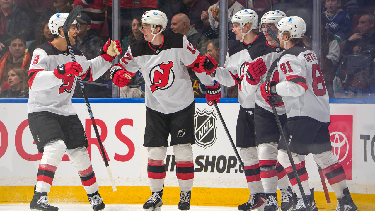 Glass has 3 points, Devils hold off Canucks