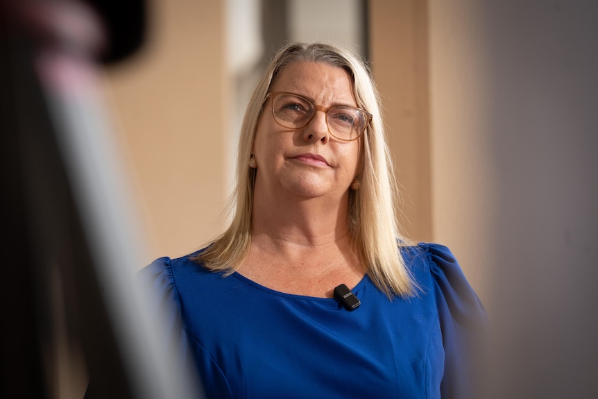 A woman in a blue dress