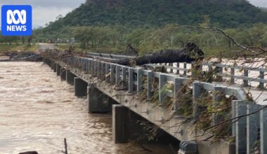 Tropical low triggers flood evacuations in the north as extreme heat builds in Queensland's south‑west