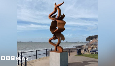 The CGI design for the installation, on a plinth, with the sea in front of it
