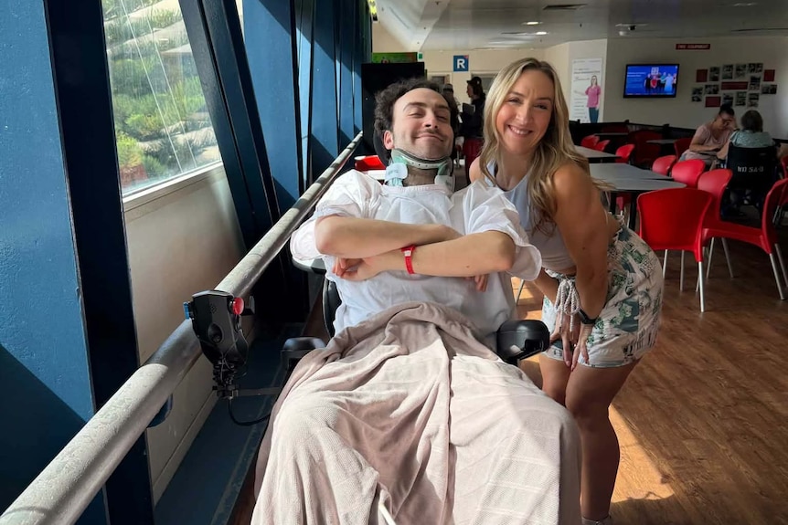 Ioannis in wheelchair with cousin Aristea.