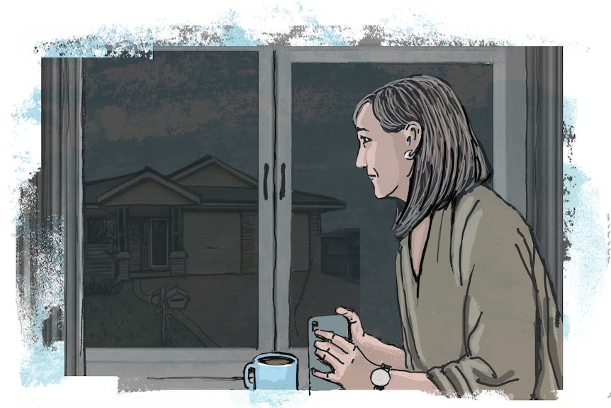 A woman looking concerned while looking out a window