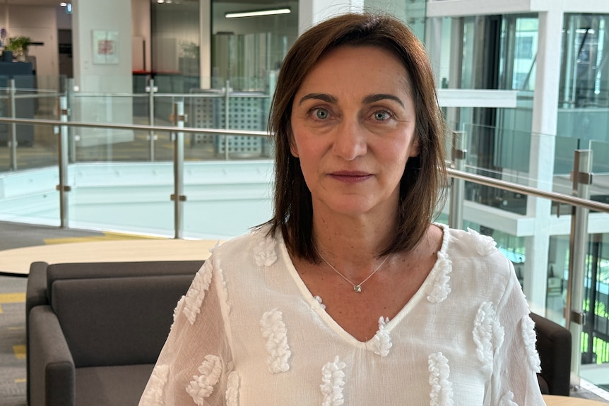 Katrina Samios sitting in an office.