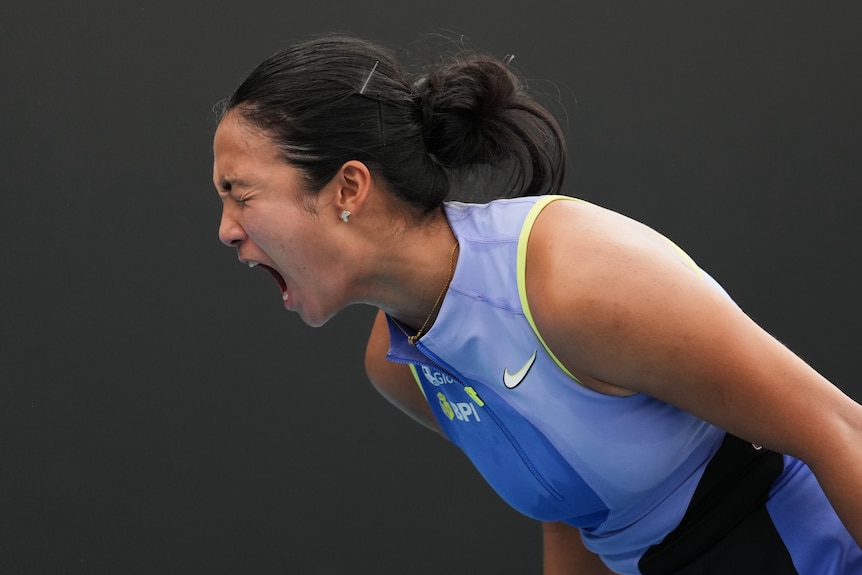 Alex Eala shouts during a tennis match at the Australian Open.