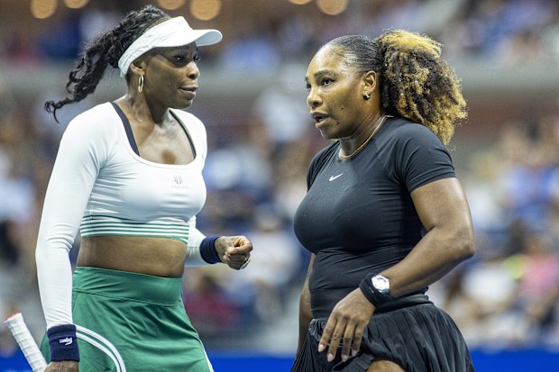 Venus Williams (left) and her sister Serena playing as a doubles pair at the 2022 US Open.