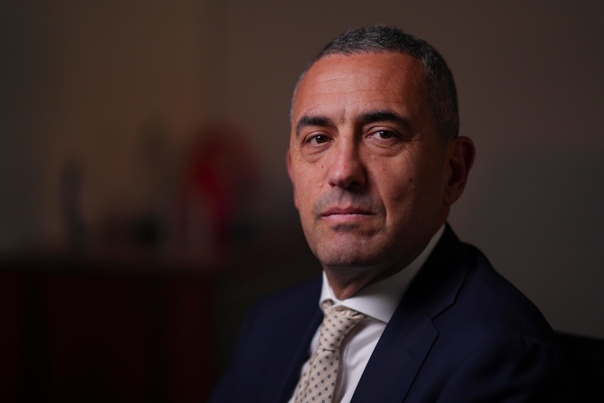 A man wearing a suit and tie