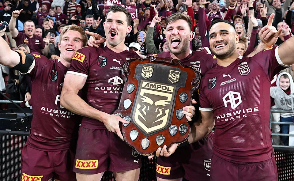 Corey Oates, pictured here with Maroons teammates after winning the 2022 State of Origin series.