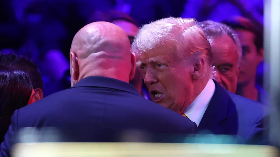MIAMI, FLORIDA - APRIL 12: President of the United States Donald Trump (R) speaks with UFC CEO Dana White (L) during UFC 314 at Kaseya Center on April 12, 2025 in Miami, Florida. (Photo by Megan Briggs/Getty Images)