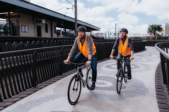 Aspect Studios’ Scott Badham (left) and Jason Packenham test the ramp ahead of its opening.
