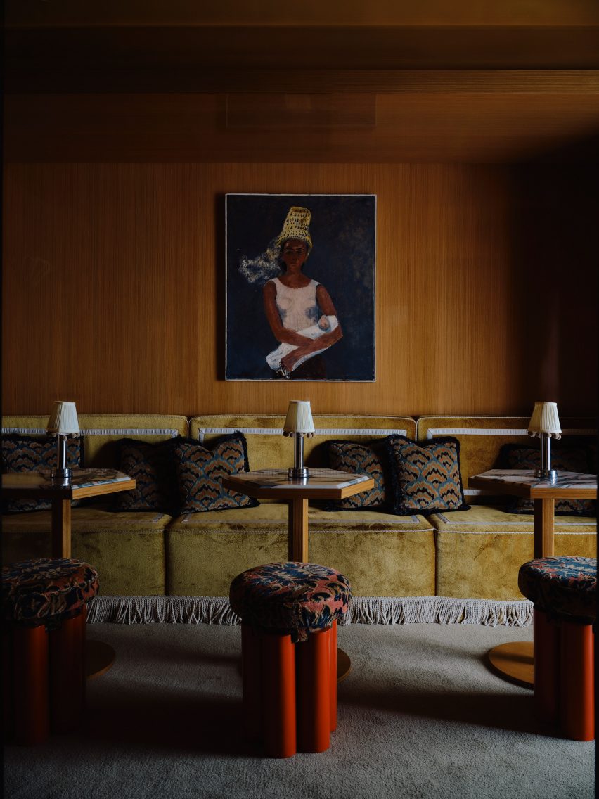 Upholstered yellow velvet seating banquette