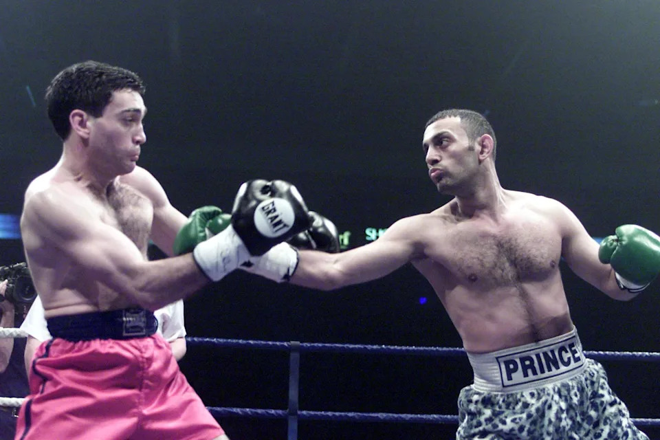 Naseem Hamed exchanges punches with Manuel Calvo during their IBO Featherweight title contest